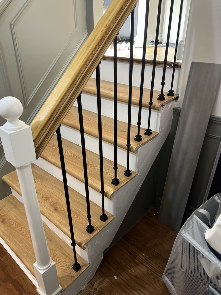 Custom Staircase with Wood Treads and Iron Balusters