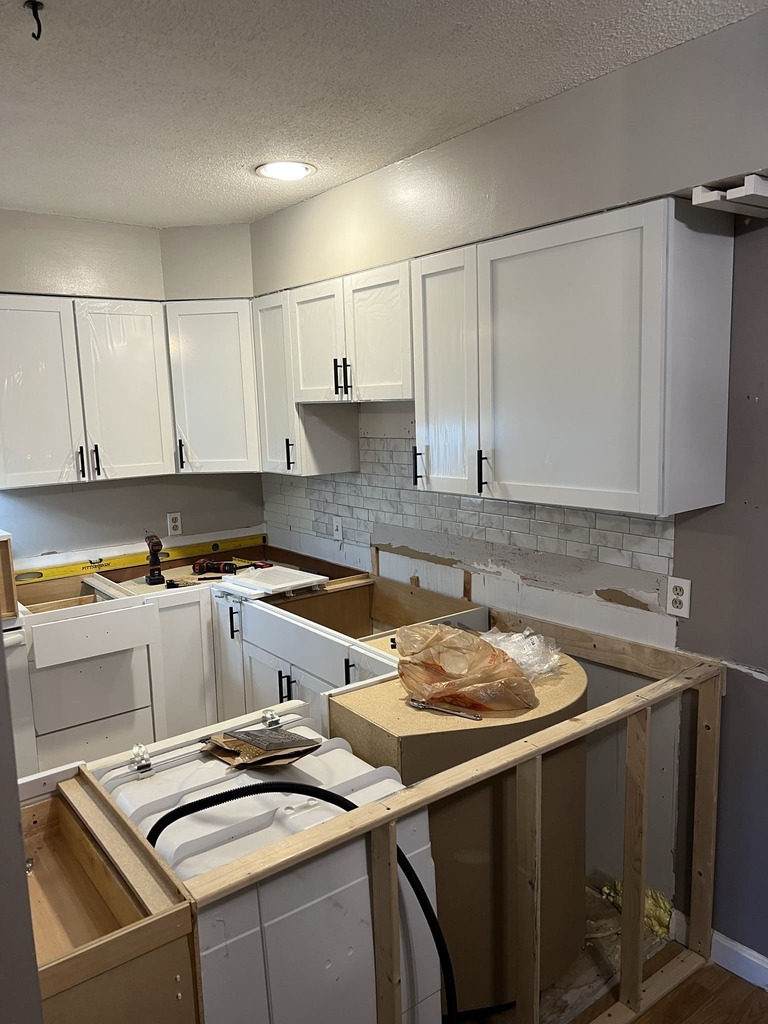 Kitchen Construction - White Cabinets Installation