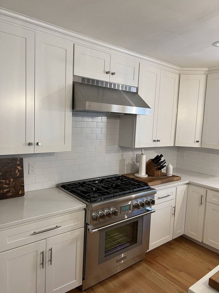 Elegant White Kitchen with Professional Gas Range